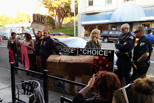 Abortion advocates try to block our "Choice" signs at a Planned Parenthood fundraiser in Bellingham, Washington on September 29th.